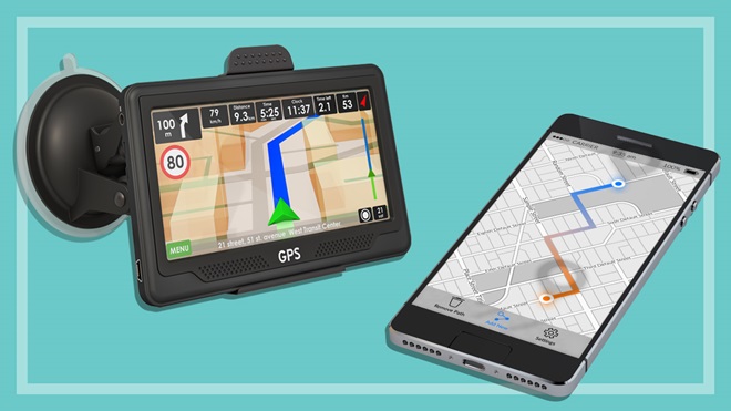 car navigation unit next to a smartphone with a map app